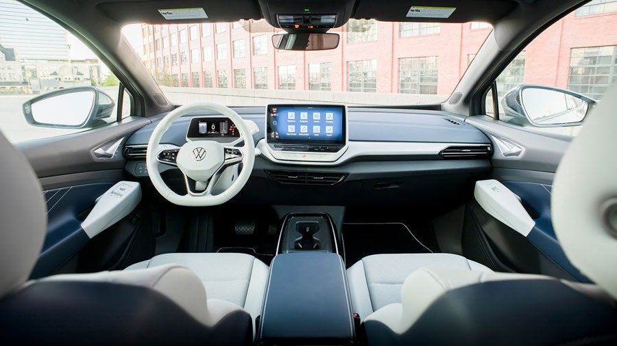 View of front cockpit area of an ID.4 shown in Cosmic interior as seen from the back seat.